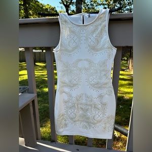 Off white and gold, form fitting dress.